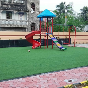 A colorful playground a red slide, climbing frame